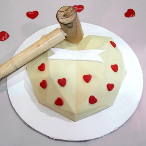 Luscious White Heart Shape Piata Cake