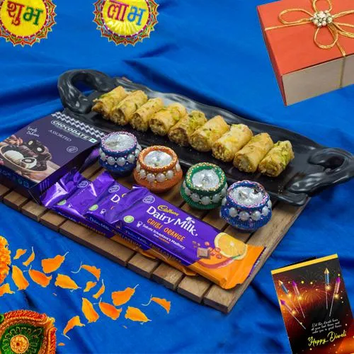 Classy Combo of Roll Baklava n Cadbury Chocolates with Wax Diya