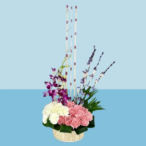 Exclusive Tall Basket Arrangement with Artificial Sticks