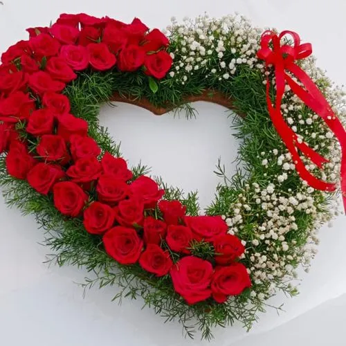 Stunning Heart Shaped Arrangement of Red Rose with white Baby Breath fillers