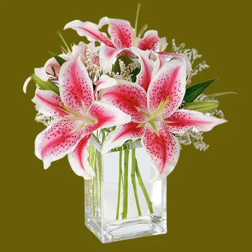 Pretty assemble of Pink Lilies in Glass Vase